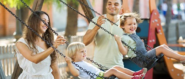 kids on swings with parents