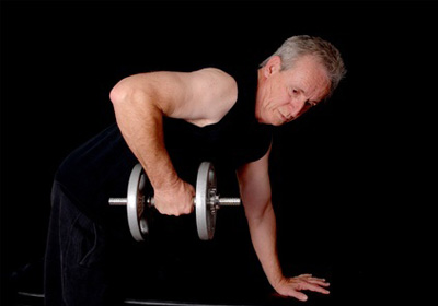 a 60-year old man doing workout