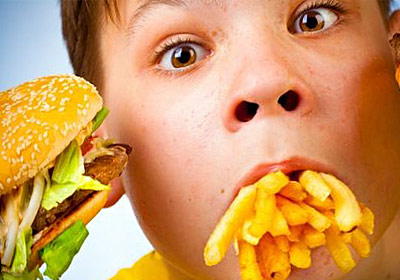 fat child eating french fries