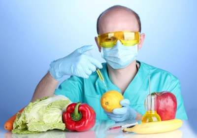 a scientist injecting GMO crops