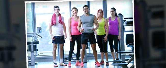 group of people exercising at the gym